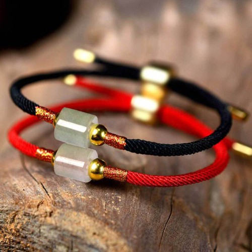Aventurine attracts prosperity and the red string enhances confidence and positive energy