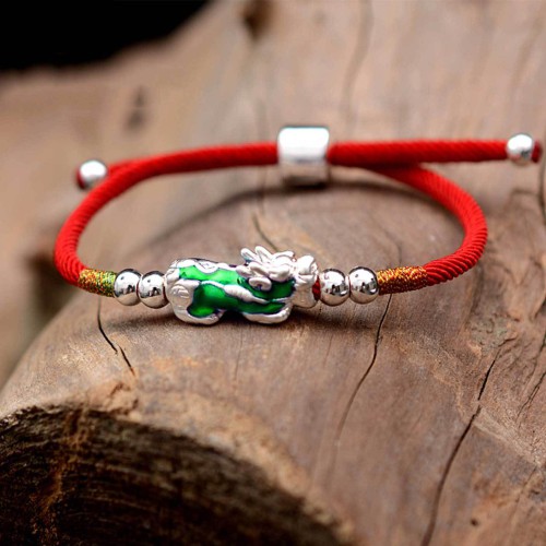 Pixiu brings wealth and protection, while silver enhances clarity and focus Pixiu brings wealth and protection, while silver enhances clarity and focus