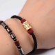 The red string provides good luck and protection against negative energy The red string provides good luck and protection against negative energy