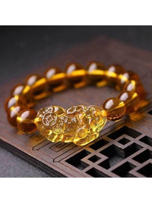 Citrine promotes wealth, and the Pixiu provides protection and good fortune