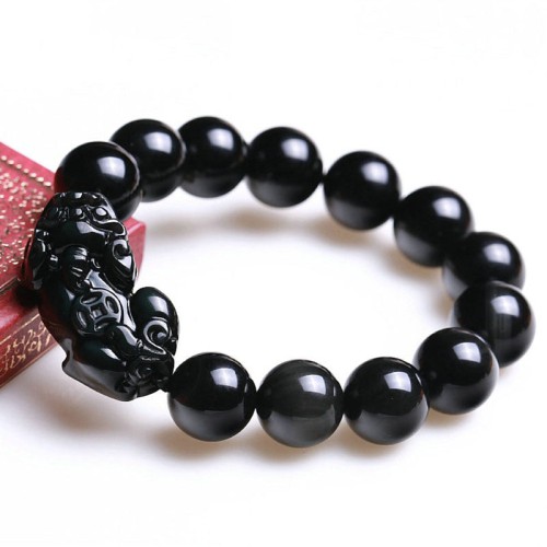 Black Obsidian shields against negativity, while Pixiu attracts wealth and success Black Obsidian shields against negativity, while Pixiu attracts wealth and success