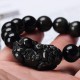 Black Obsidian shields against negativity, while Pixiu attracts wealth and success Black Obsidian shields against negativity, while Pixiu attracts wealth and success