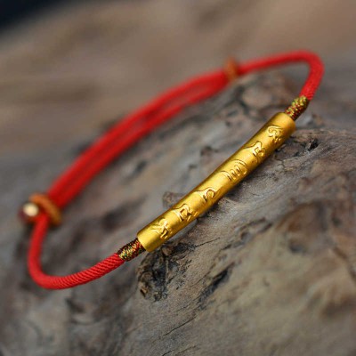 The red string brings good luck and protection, aligned with Tibetan Buddhist teachings